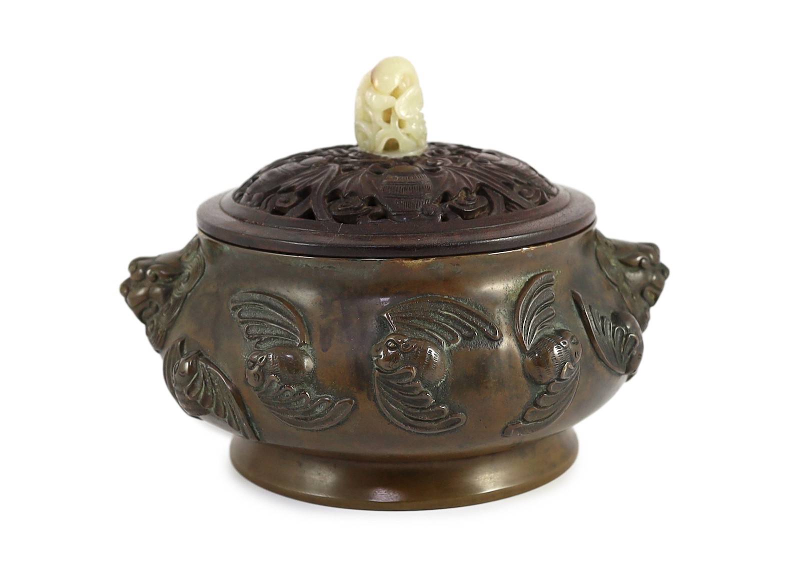A large Chinese bronze ding censer, the wood cover with pale celadon jade finial, 22cm across